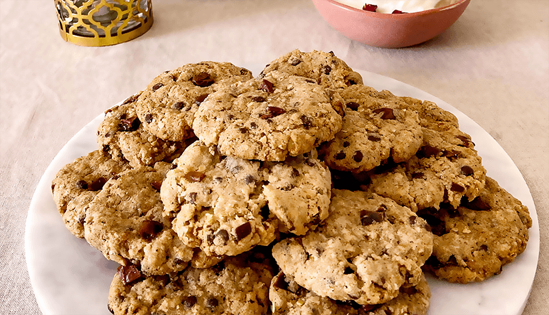 oats and date choco chip cookies served on white plate